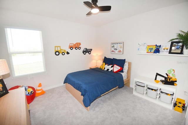 bedroom with ceiling fan and light colored carpet