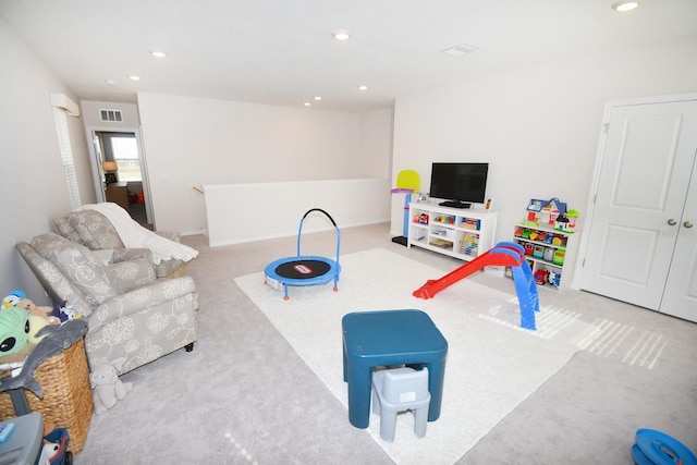 game room with light colored carpet