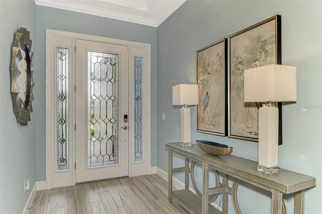 entrance foyer featuring light hardwood / wood-style floors and crown molding