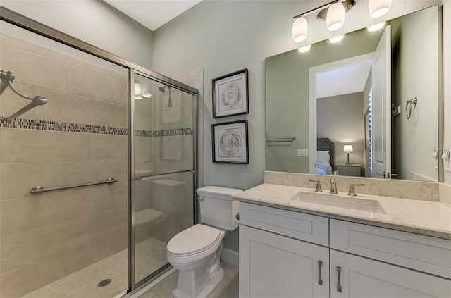 bathroom with toilet, vanity, an enclosed shower, and tile patterned flooring