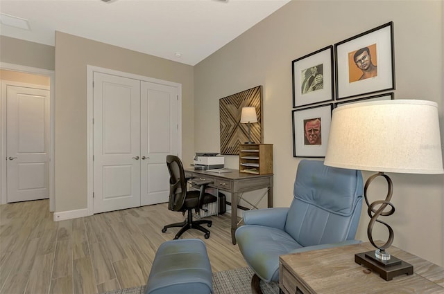 office space with light hardwood / wood-style floors