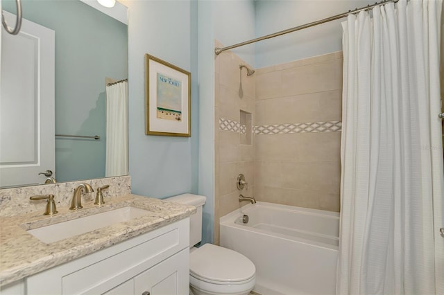 full bathroom with shower / tub combo with curtain, vanity, and toilet