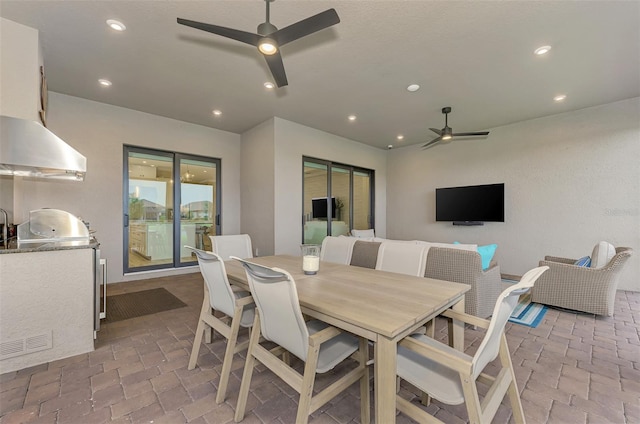 view of patio / terrace featuring ceiling fan