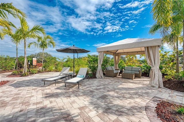 view of patio with an outdoor hangout area and a gazebo