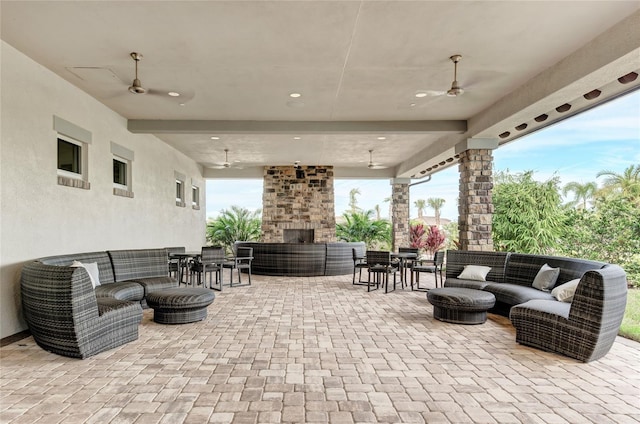 view of patio / terrace featuring ceiling fan and an outdoor living space