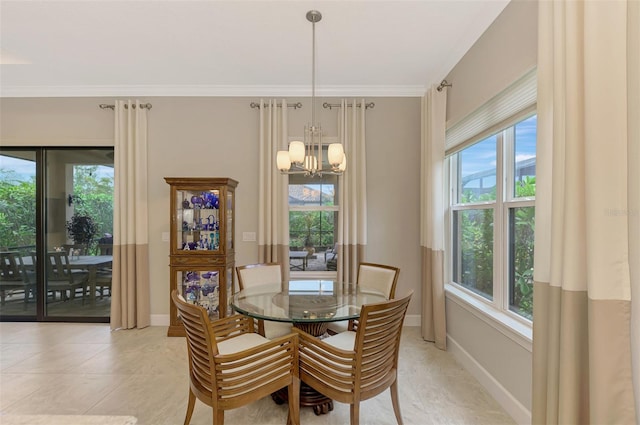 dining room with a healthy amount of sunlight, an inviting chandelier, and ornamental molding