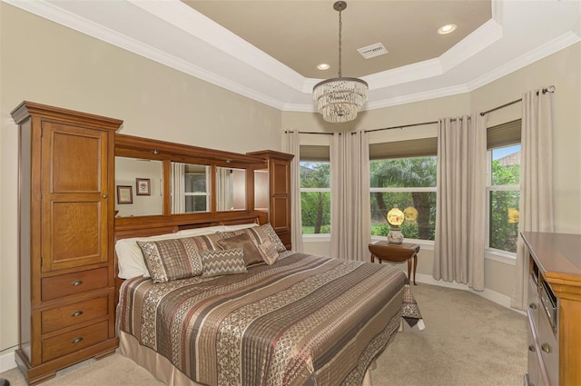 bedroom with light colored carpet, a notable chandelier, crown molding, and a tray ceiling