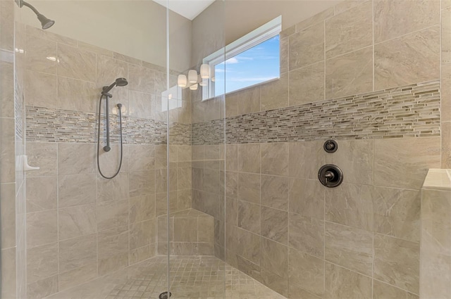 bathroom featuring tiled shower