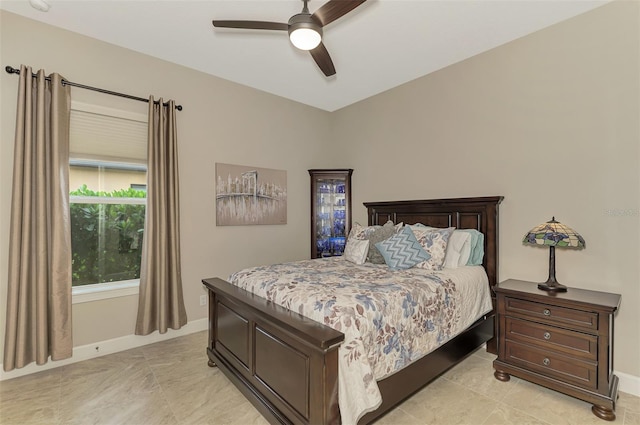 tiled bedroom with ceiling fan