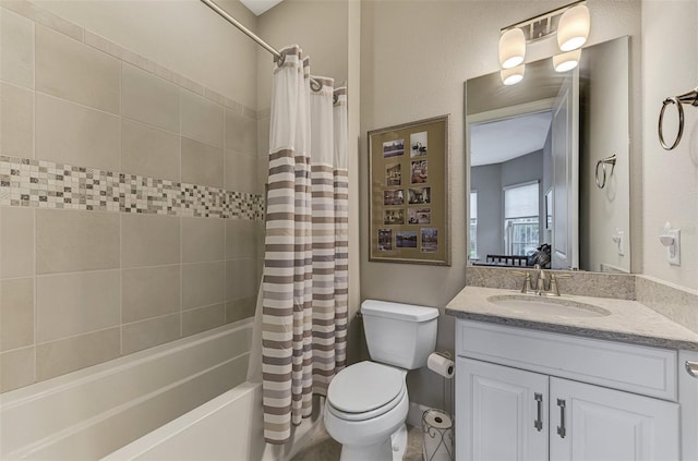 full bathroom featuring vanity, toilet, and shower / bath combination with curtain