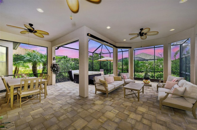 sunroom featuring ceiling fan