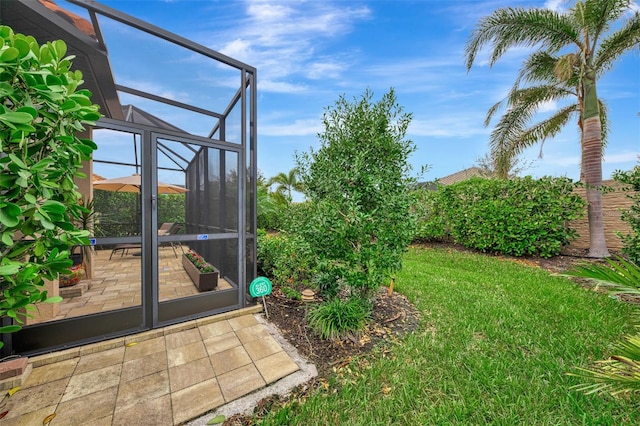 view of yard featuring a lanai and a patio