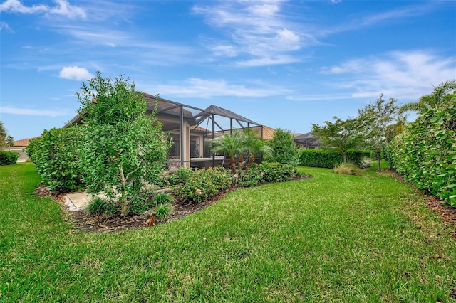 view of yard with a lanai