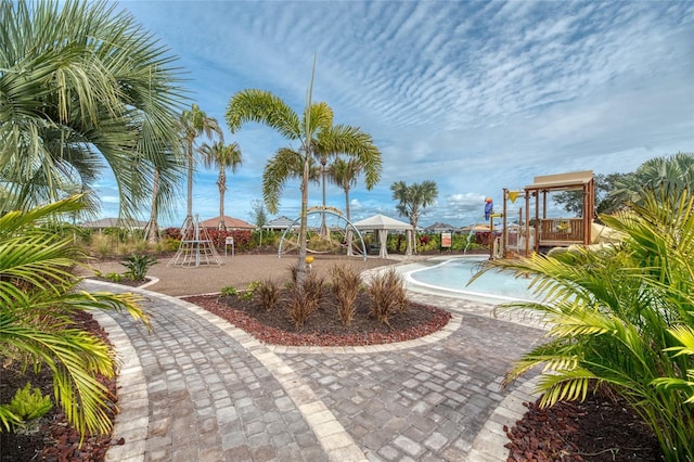 surrounding community featuring a gazebo and a playground
