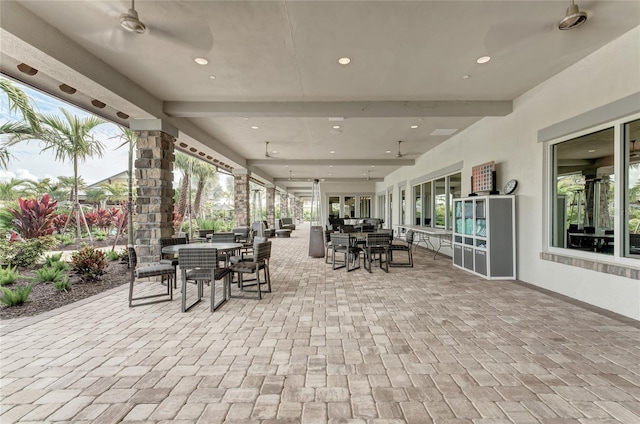 view of patio featuring ceiling fan