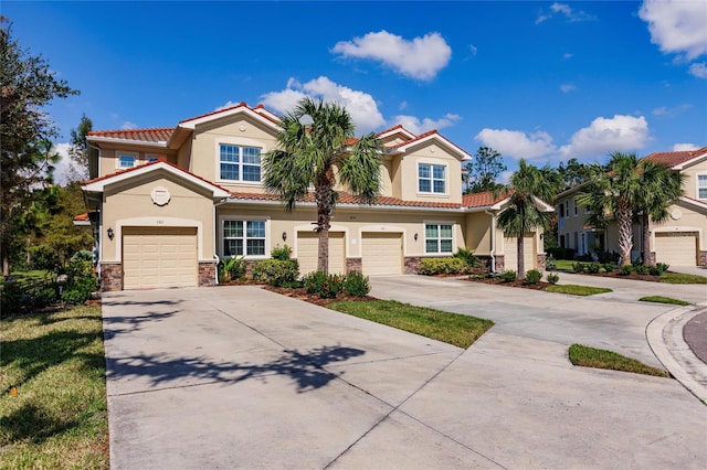 mediterranean / spanish-style home featuring a garage