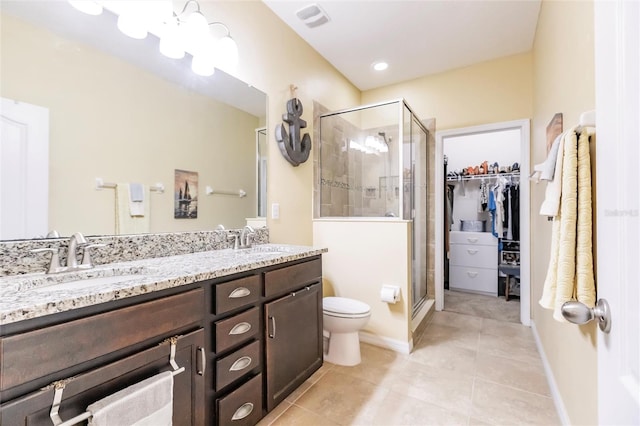 bathroom with a sink, visible vents, and a shower stall