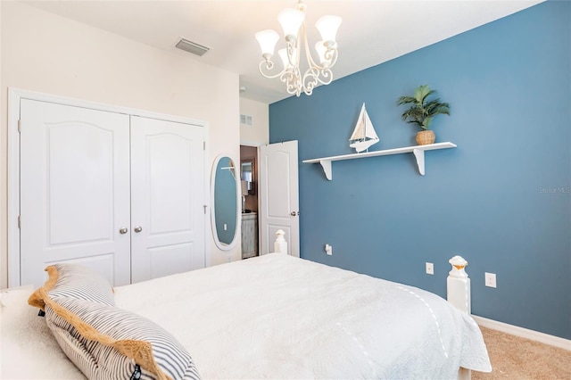 carpeted bedroom featuring baseboards, visible vents, a chandelier, and a closet