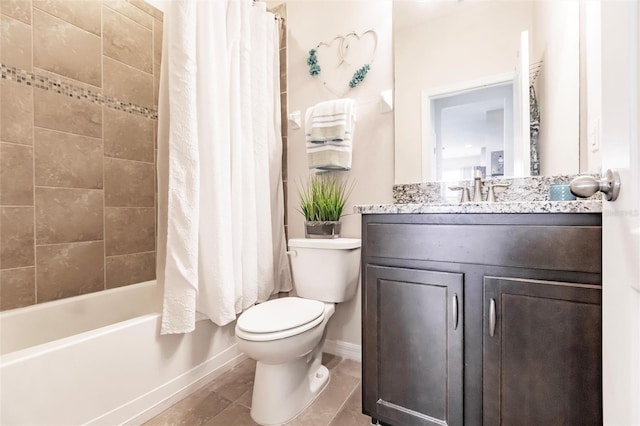 bathroom with shower / tub combo with curtain, vanity, toilet, and baseboards