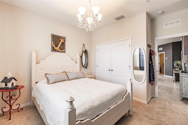 bedroom featuring light colored carpet, a closet, visible vents, and baseboards