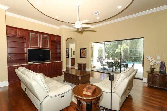 living room featuring dark wood-type flooring and ornamental molding