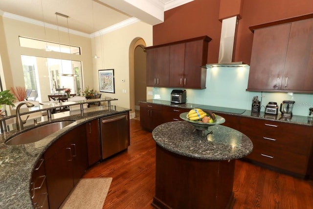 kitchen with extractor fan, sink, dark hardwood / wood-style floors, hanging light fixtures, and stainless steel dishwasher