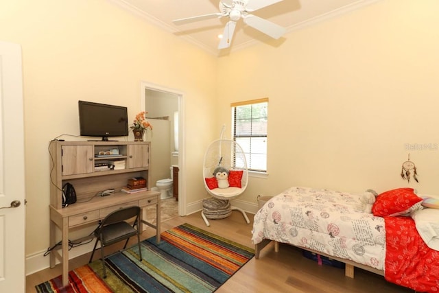 bedroom with ensuite bath, wood-type flooring, ceiling fan, and crown molding