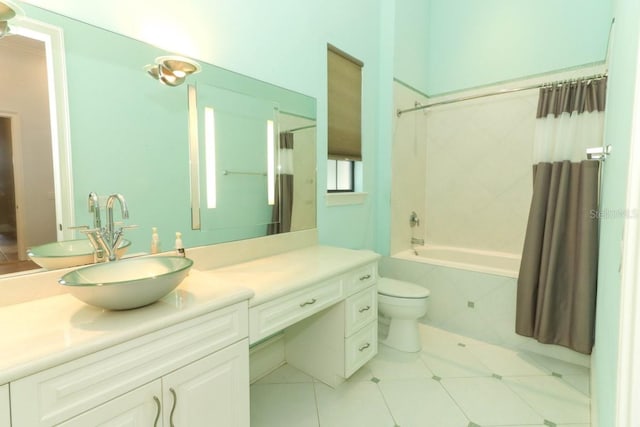 full bathroom featuring tile patterned flooring, vanity, toilet, and shower / tub combo with curtain