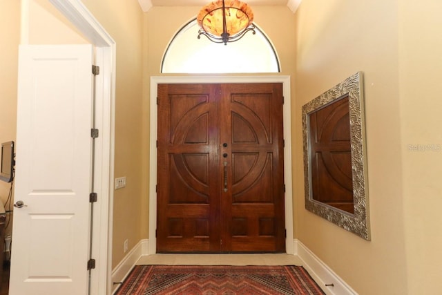 doorway featuring ornamental molding