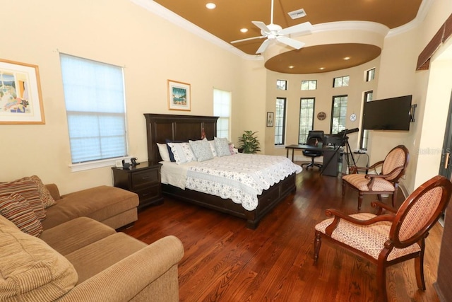 bedroom featuring dark hardwood / wood-style flooring, multiple windows, crown molding, and ceiling fan