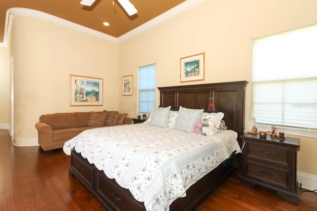 bedroom with ornamental molding, dark hardwood / wood-style floors, and ceiling fan