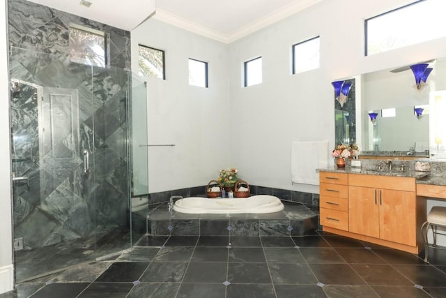 bathroom with a wealth of natural light, shower with separate bathtub, crown molding, and vanity