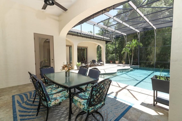 view of swimming pool with a lanai, ceiling fan, and a patio area