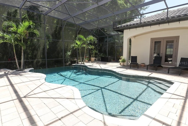 view of pool featuring a lanai, french doors, and a patio area