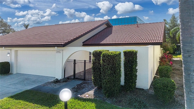 view of side of home featuring a garage