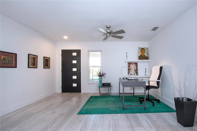 office space featuring light hardwood / wood-style floors and ceiling fan