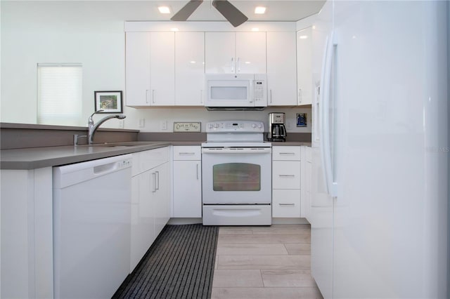 kitchen featuring white cabinetry, sink, ceiling fan, and white appliances