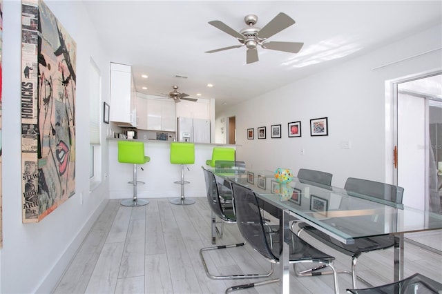 dining area with light hardwood / wood-style floors