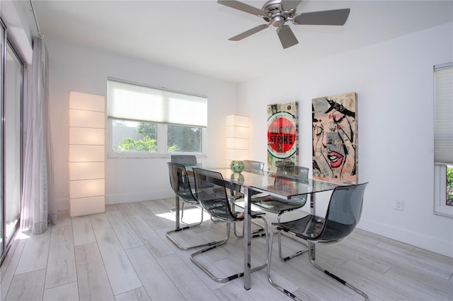 dining space with ceiling fan and light hardwood / wood-style floors