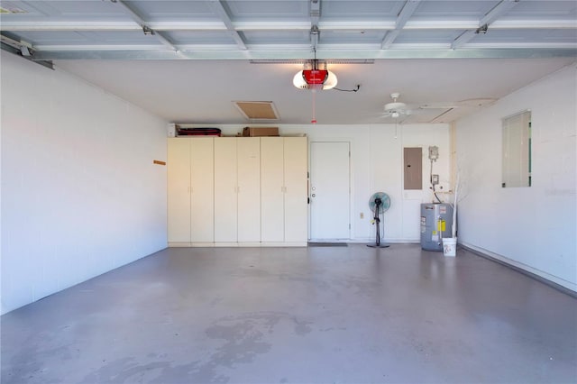 garage with electric panel, a garage door opener, and water heater