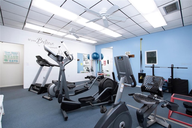 workout area featuring a drop ceiling and ceiling fan