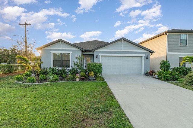 view of front of home featuring a front lawn and a garage