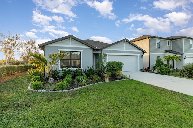 view of front of property featuring a front lawn and a garage