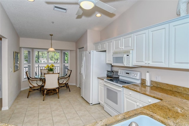 kitchen featuring vaulted ceiling, hanging light fixtures, a textured ceiling, white cabinetry, and white appliances