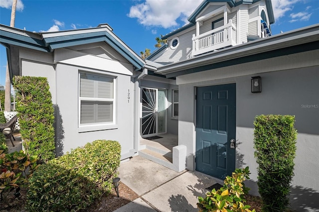 entrance to property with a balcony