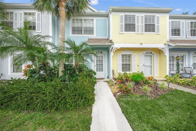 view of property with a front lawn