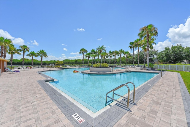 view of swimming pool with a patio area