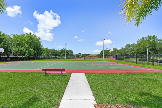 view of basketball court featuring a yard