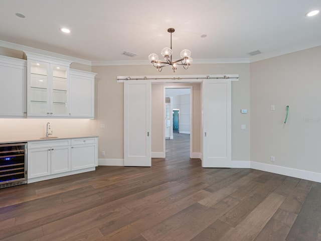 interior space featuring dark hardwood / wood-style floors, white cabinetry, and wine cooler