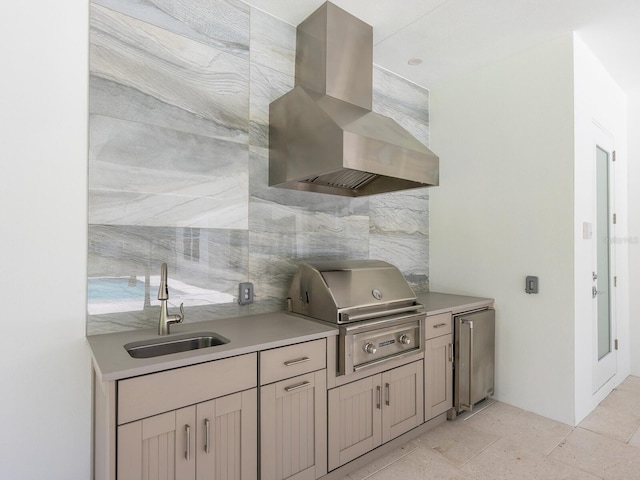 kitchen with backsplash, sink, wall chimney exhaust hood, light tile patterned floors, and stainless steel refrigerator